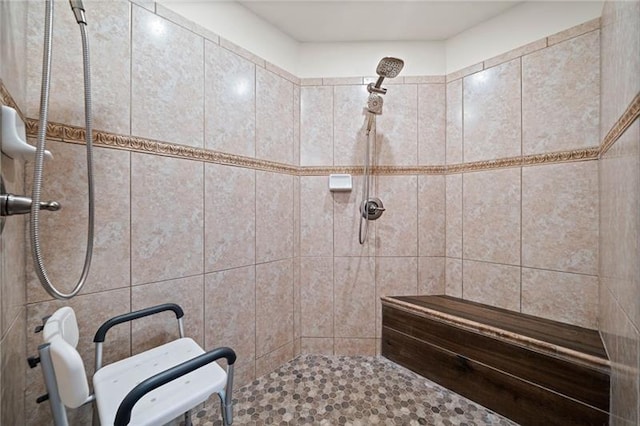 bathroom with tiled shower