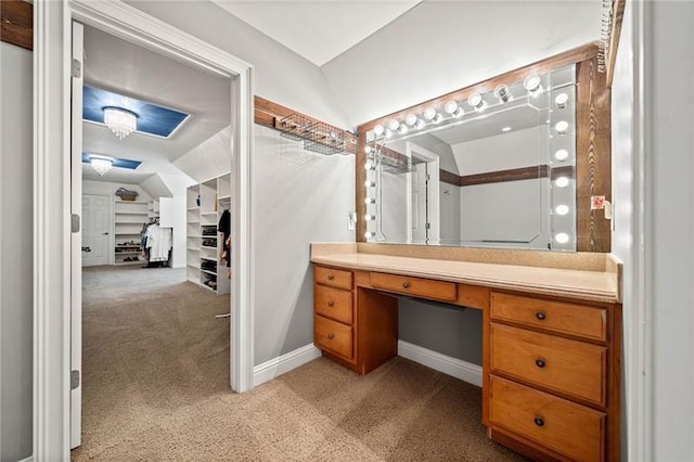 bathroom featuring vanity and vaulted ceiling