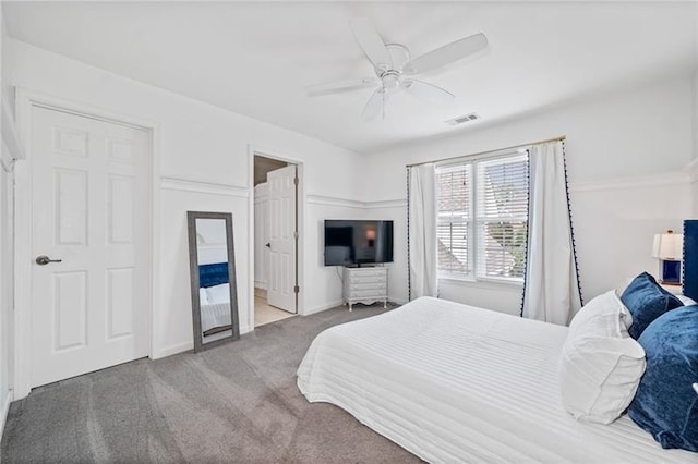 carpeted bedroom with ceiling fan