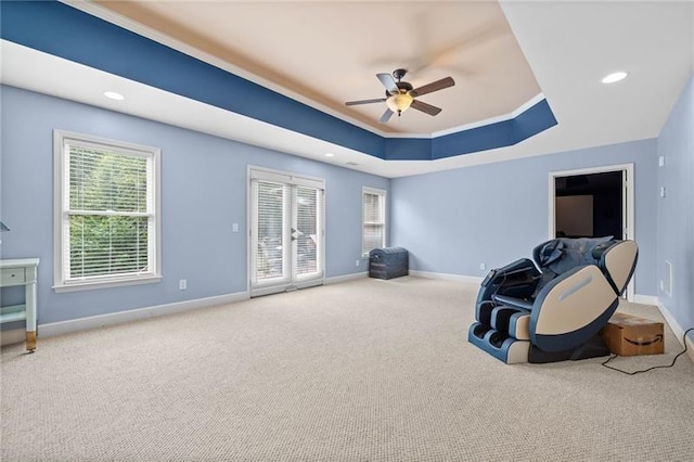 misc room featuring crown molding, a raised ceiling, ceiling fan, and carpet flooring