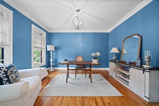 office featuring an inviting chandelier, wood-type flooring, and ornamental molding