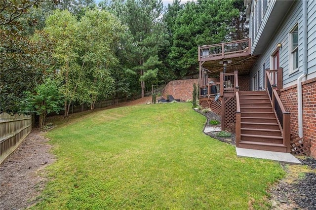 view of yard featuring a wooden deck