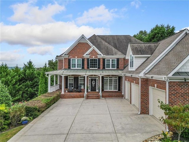 view of front of house with a garage and covered porch