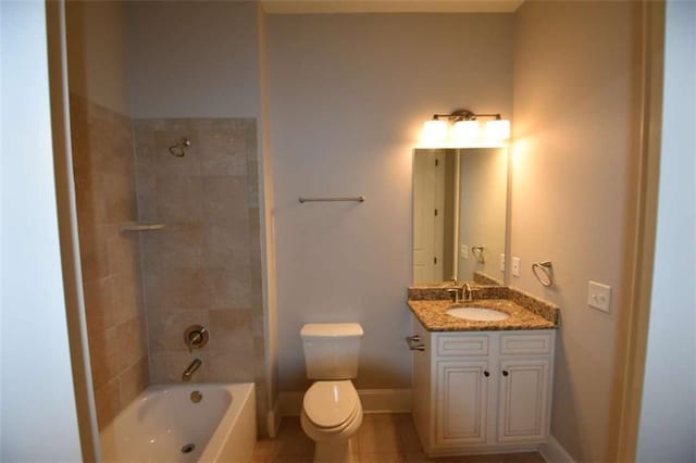 full bathroom with tile patterned flooring, vanity, toilet, and tiled shower / bath