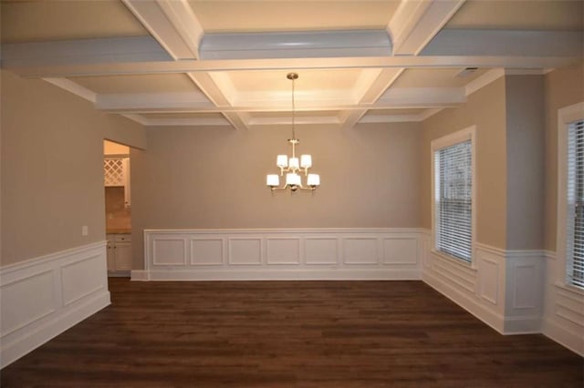 unfurnished dining area featuring dark wood-type flooring and a chandelier