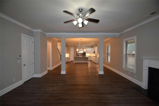 unfurnished living room with ceiling fan, crown molding, and dark hardwood / wood-style floors