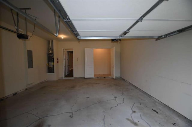 garage with electric panel and a garage door opener