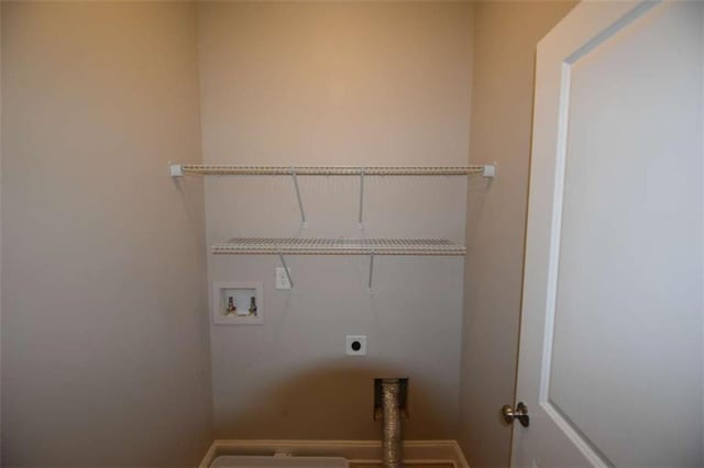 laundry area with hookup for an electric dryer and washer hookup