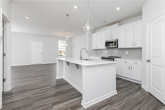 805 York Aly, Acworth, GA 30102 - kitchen with appliances with stainless steel finishes, dark wood-style floors, backsplash, light countertops, and recessed lighting