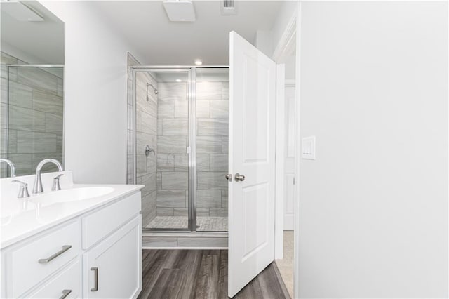 805 York Aly, Acworth, GA 30102 - bathroom featuring vanity, a stall shower, wood finished floors, and recessed lighting
