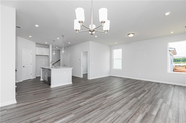 805 York Aly, Acworth, GA 30102 - unfurnished living room with healthy amount of natural light, dark wood-style flooring, a chandelier, and recessed lighting