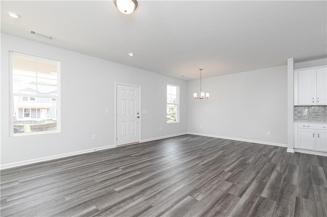 805 York Aly, Acworth, GA 30102 - unfurnished living room with a chandelier, dark wood-type flooring, and recessed lighting