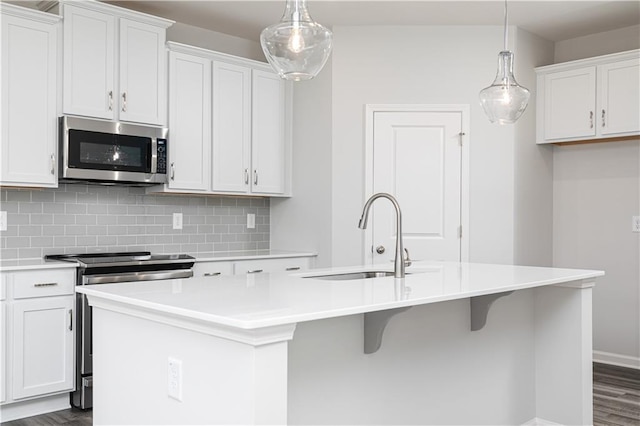 805 York Aly, Acworth, GA 30102 - kitchen featuring stainless steel appliances, tasteful backsplash, dark wood-style flooring, and a kitchen island with sink