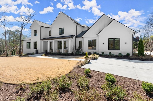4100 Thunderbird Dr, Marietta, GA 30067 - view of front facade with a standing seam roof and roof with shingles