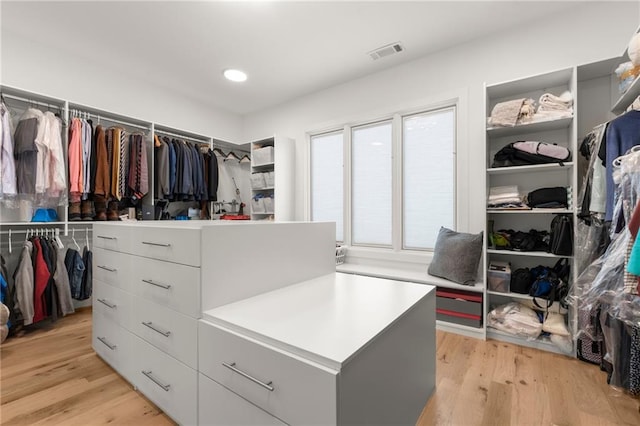 walk in closet featuring visible vents and light wood-type flooring