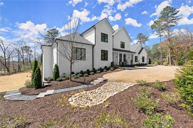 view of side of home featuring french doors