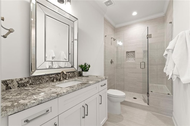 full bathroom featuring visible vents, a shower stall, vanity, and crown molding