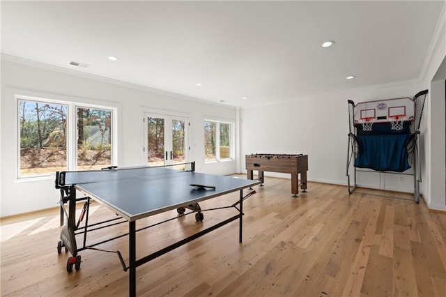 recreation room with visible vents, light wood-style flooring, recessed lighting, french doors, and crown molding