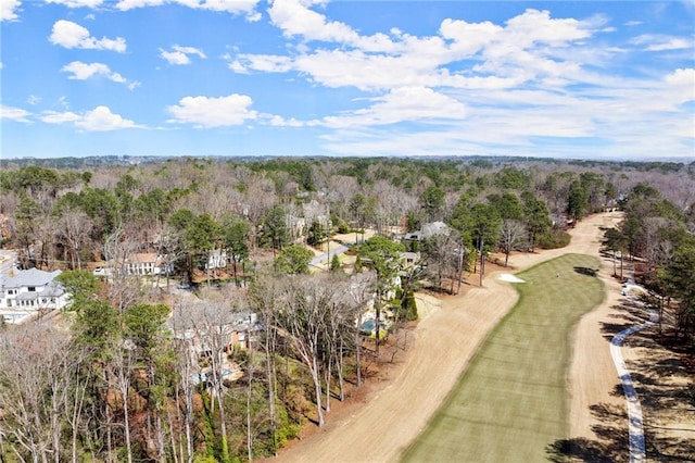 birds eye view of property with a wooded view