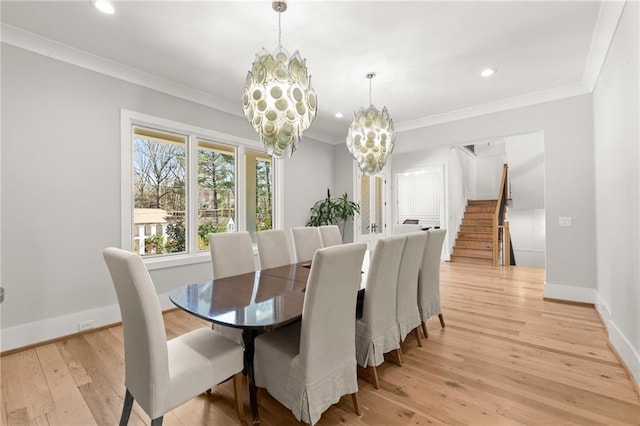 4100 Thunderbird Dr, Marietta, GA 30067 - living area with a chandelier, ornamental molding, light wood-style flooring, a glass covered fireplace, and recessed lighting