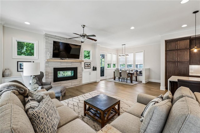 2059 Wheaton Way, Atlanta, GA 30328 - living room with plenty of natural light, ceiling fan, crown molding, light wood-type flooring, and recessed lighting