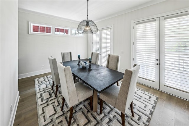 2059 Wheaton Way, Atlanta, GA 30328 - dining room with a chandelier, wood finished floors, ornamental molding, and baseboards