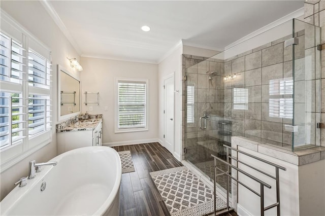 2059 Wheaton Way, Atlanta, GA 30328 - bathroom with healthy amount of natural light, a stall shower, ornamental molding, wood finished floors, and a soaking tub