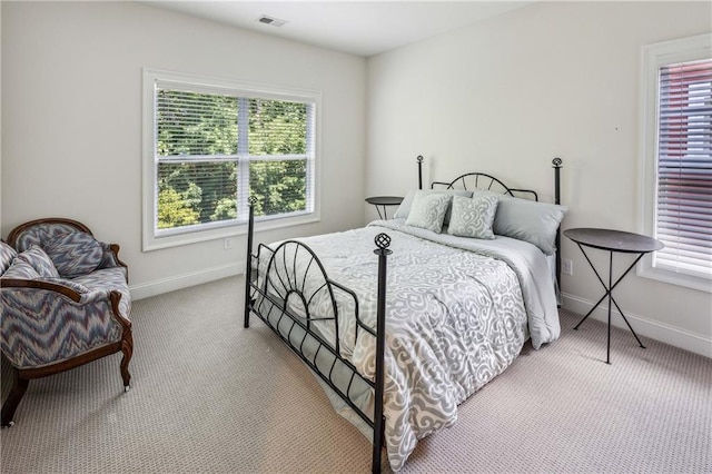 2059 Wheaton Way, Atlanta, GA 30328 - carpeted bedroom with multiple windows and baseboards