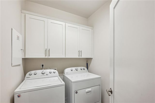 2059 Wheaton Way, Atlanta, GA 30328 - laundry area with washer and clothes dryer and cabinet space