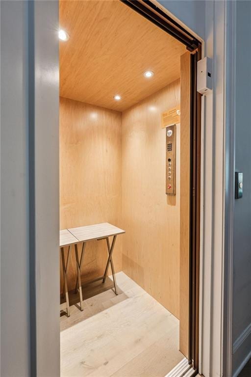 2059 Wheaton Way, Atlanta, GA 30328 - hallway with elevator and recessed lighting