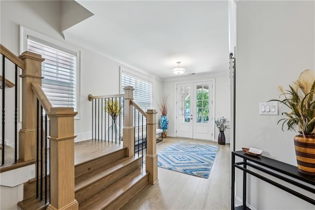 2059 Wheaton Way, Atlanta, GA 30328 - entrance foyer featuring crown molding, stairway, wood finished floors, and baseboards
