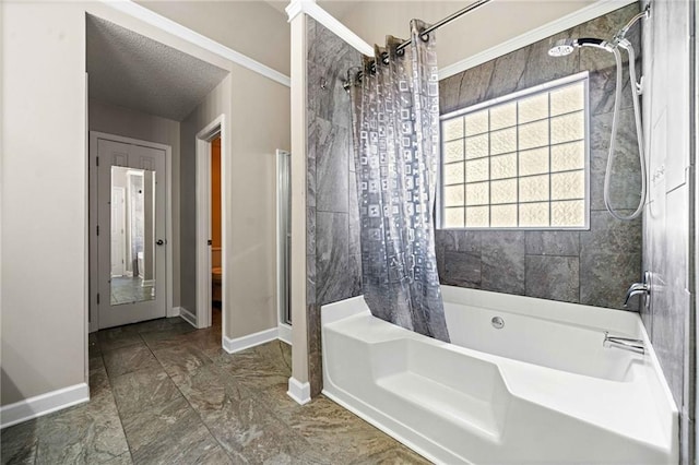 full bath with shower / bath combination with curtain, a textured ceiling, and baseboards