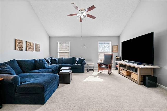 carpeted living room featuring baseboards, a healthy amount of sunlight, a ceiling fan, and vaulted ceiling