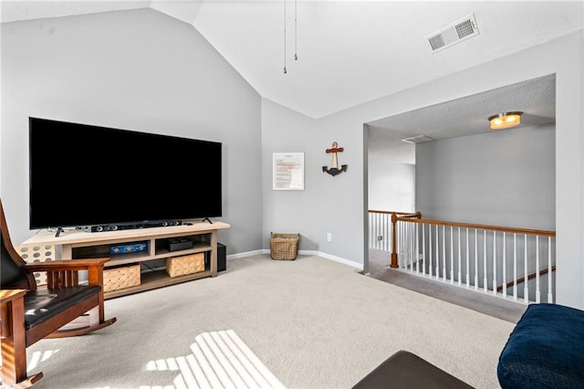 living area featuring lofted ceiling, carpet flooring, baseboards, and visible vents