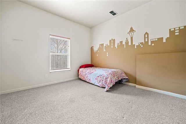 bedroom featuring visible vents, baseboards, and carpet