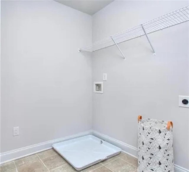 laundry area with hookup for a gas dryer, baseboards, hookup for an electric dryer, hookup for a washing machine, and laundry area