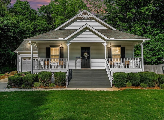 138 Victoria Ln, Lavonia, GA 30553 - view of front of house featuring roof with shingles, a porch, and a front lawn