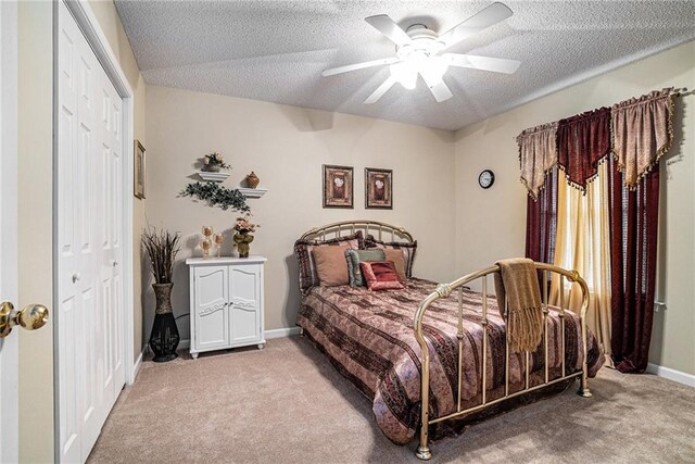 138 Victoria Ln, Lavonia, GA 30553 - carpeted bedroom with baseboards, ceiling fan, a closet, and a textured ceiling