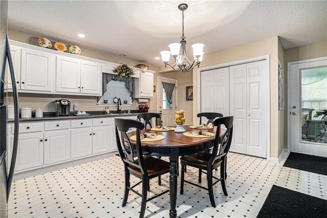 138 Victoria Ln, Lavonia, GA 30553 - dining area featuring recessed lighting, a textured ceiling, a notable chandelier, and light floors