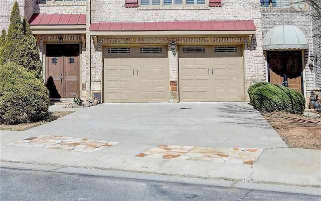 garage featuring driveway