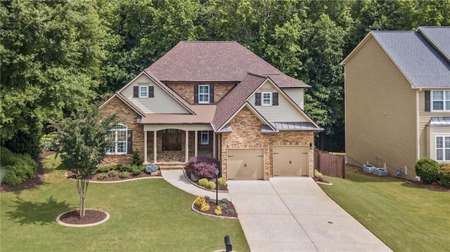 2430 Hemrick Rd, Cumming, GA 30041 - view of front of home with stone siding, concrete driveway, an attached garage, and a standing seam roof