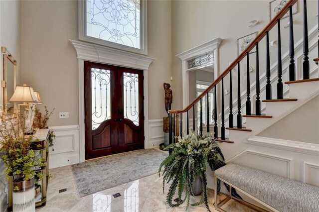 foyer with a towering ceiling