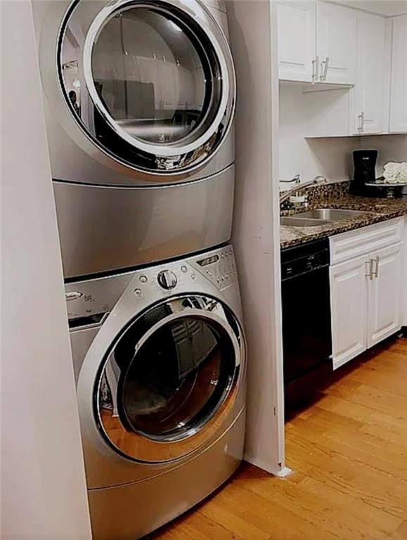 2479 Peachtree Rd Unit 503, Atlanta, GA 30305 - laundry area with estacked washer and dryer and light wood finished floors