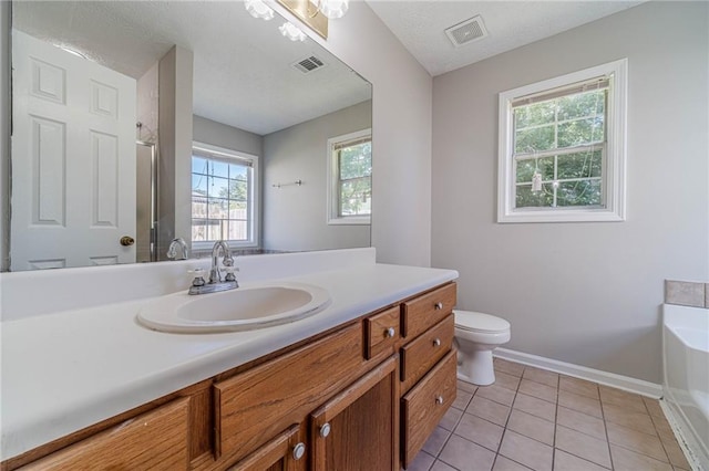 647 New England Way, Lawrenceville, GA 30046 - bathroom with a garden tub, vanity, an enclosed shower, toilet, and baseboards