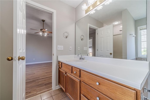647 New England Way, Lawrenceville, GA 30046 - bathroom with vanity, tile patterned floors, ceiling fan, and baseboards