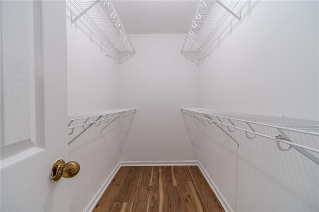647 New England Way, Lawrenceville, GA 30046 - spacious closet featuring dark wood-type flooring