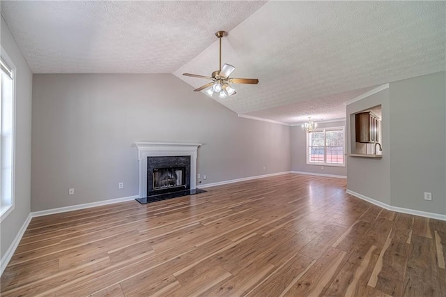 647 New England Way, Lawrenceville, GA 30046 - unfurnished living room with light wood-type flooring, a chandelier, ceiling fan, a textured ceiling, and a fireplace