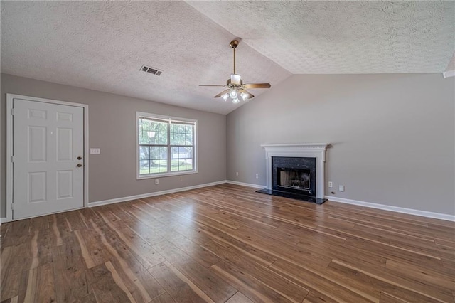 647 New England Way, Lawrenceville, GA 30046 - unfurnished living room with a ceiling fan, a textured ceiling, wood-type flooring, a fireplace, and vaulted ceiling