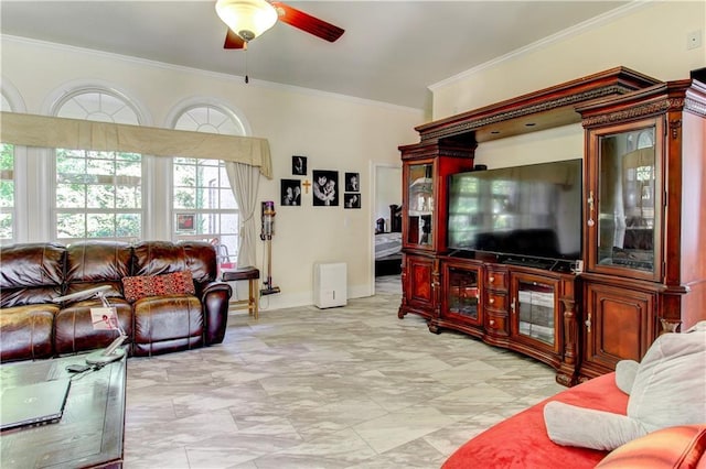 living room with ceiling fan and ornamental molding