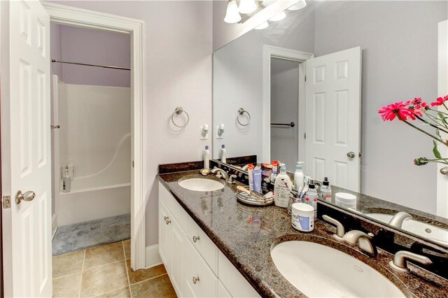 bathroom featuring shower / bathing tub combination, vanity, and tile patterned floors